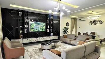 Comfort Apartment, Balcony, City View | Living area | Flat-screen TV