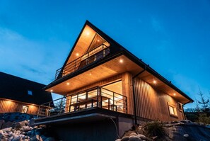 A modern wooden cabin with a balcony, a staircase, and a large window. - Holiday Home With Sauna and Mountain View (Bukowina Tatrzanska)