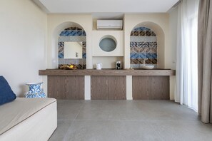A modern kitchen with a built-in oven, a coffee machine, and a sink. - Bellini apartament, relax cozy sea view apartment in Taormina (Sicilia)