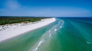 An aerial view of a beach with clear turquoise waters and white sand. - 2 Person Holiday Park Home in Nexo (Nexø)