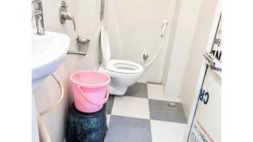 Shower, rainfall showerhead, slippers, towels