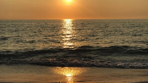A sunset over a calm sea with gentle waves. - Apartment in Paradise! Feb/March 2027 availability! (Naples)