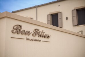 A building with a sign that reads 'Bon Filias Luxury Mansion.' - Bon Filius - Luxury Private Villa w Pool in Chania (Apokoronas)