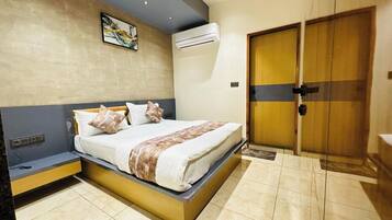 Deluxe Double Room, City View | In-room safe, desk, laptop workspace, iron/ironing board