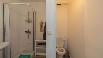 Shower, hair dryer, towels, toilet paper