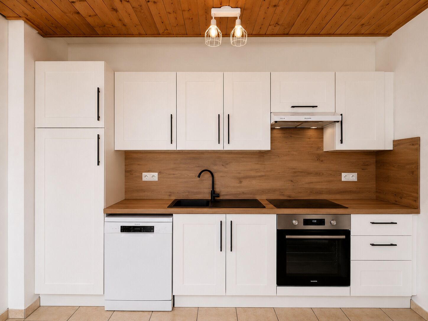 A modern kitchen with white cabinets, a wooden countertop, a black sink, a dishwasher, and an oven.