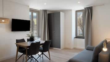 Apartamento clássico, 1 cama Queen e sofá-cama, vista para a montanha | Área de estar