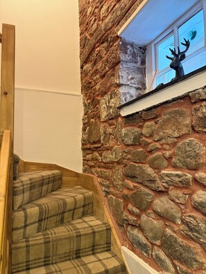 A staircase with wooden steps and a stone wall. - Family/2 couple dog friendly character cottage IN Lake District National Park (Gosforth)