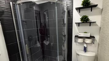 Shower, hair dryer, towels, soap