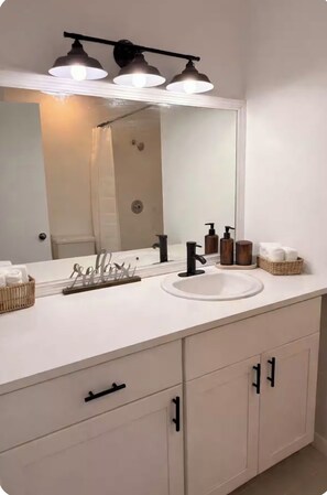 Shower, towels, soap, toilet paper - Quiet studio w private outdoor area close to major amenities (Sunrise)