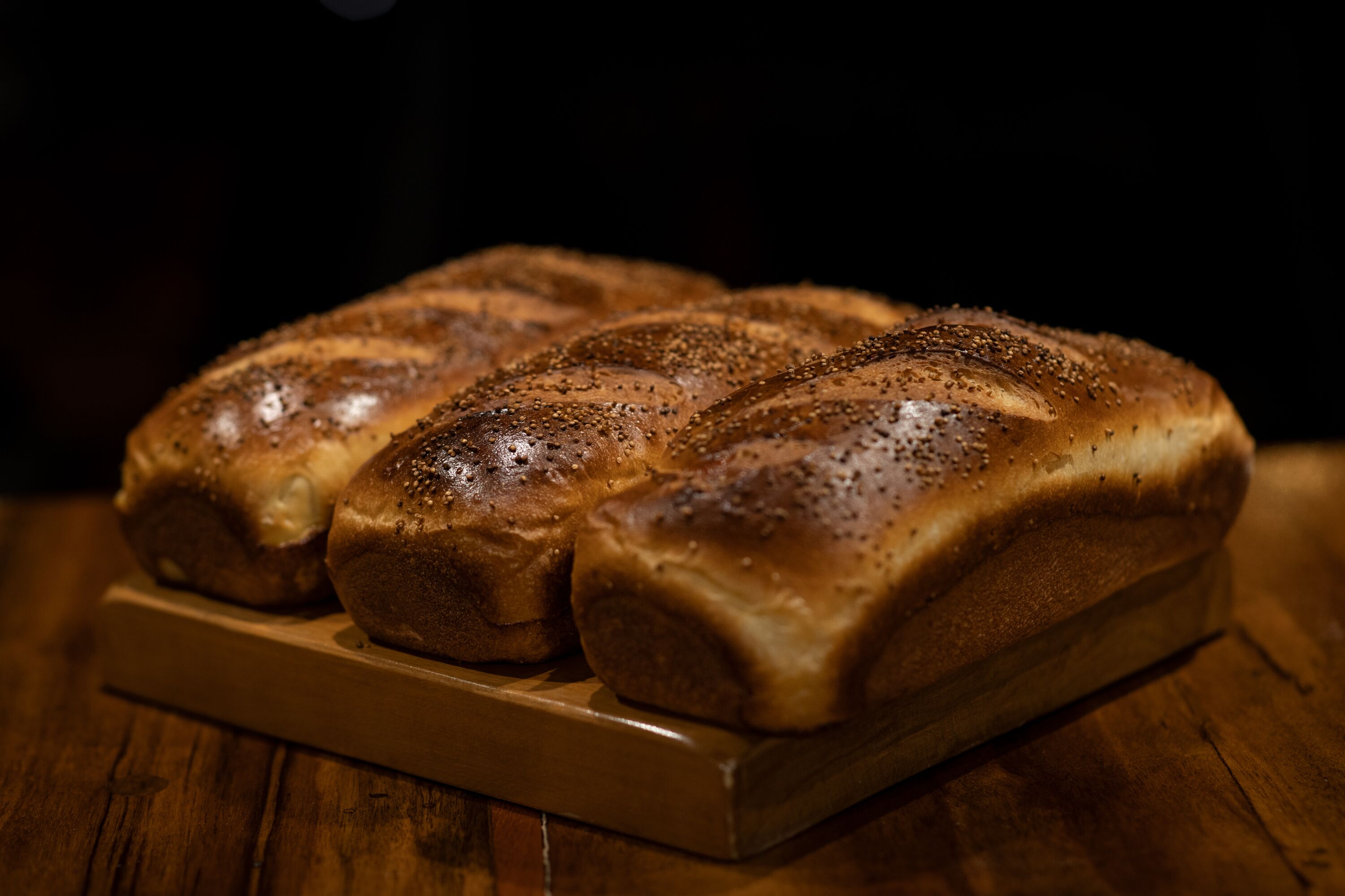 A loaf of bread with seeds on top.