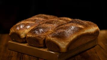 A loaf of bread with seeds on top.