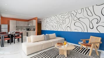 Apartment, City View | Living area | 121-cm Smart TV with digital channels, pay movies