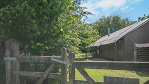 A rustic wooden gate leading to a campsite with a tented accommodation structure. - 3 Bed in Arley (oc-s42696) (Pound Green)