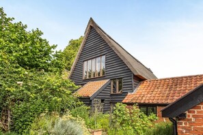 A traditional house with a steeply pitched roof, multiple windows, and a brick extension. - 3 Bed in Chediston (oc-b43313) (Chediston)