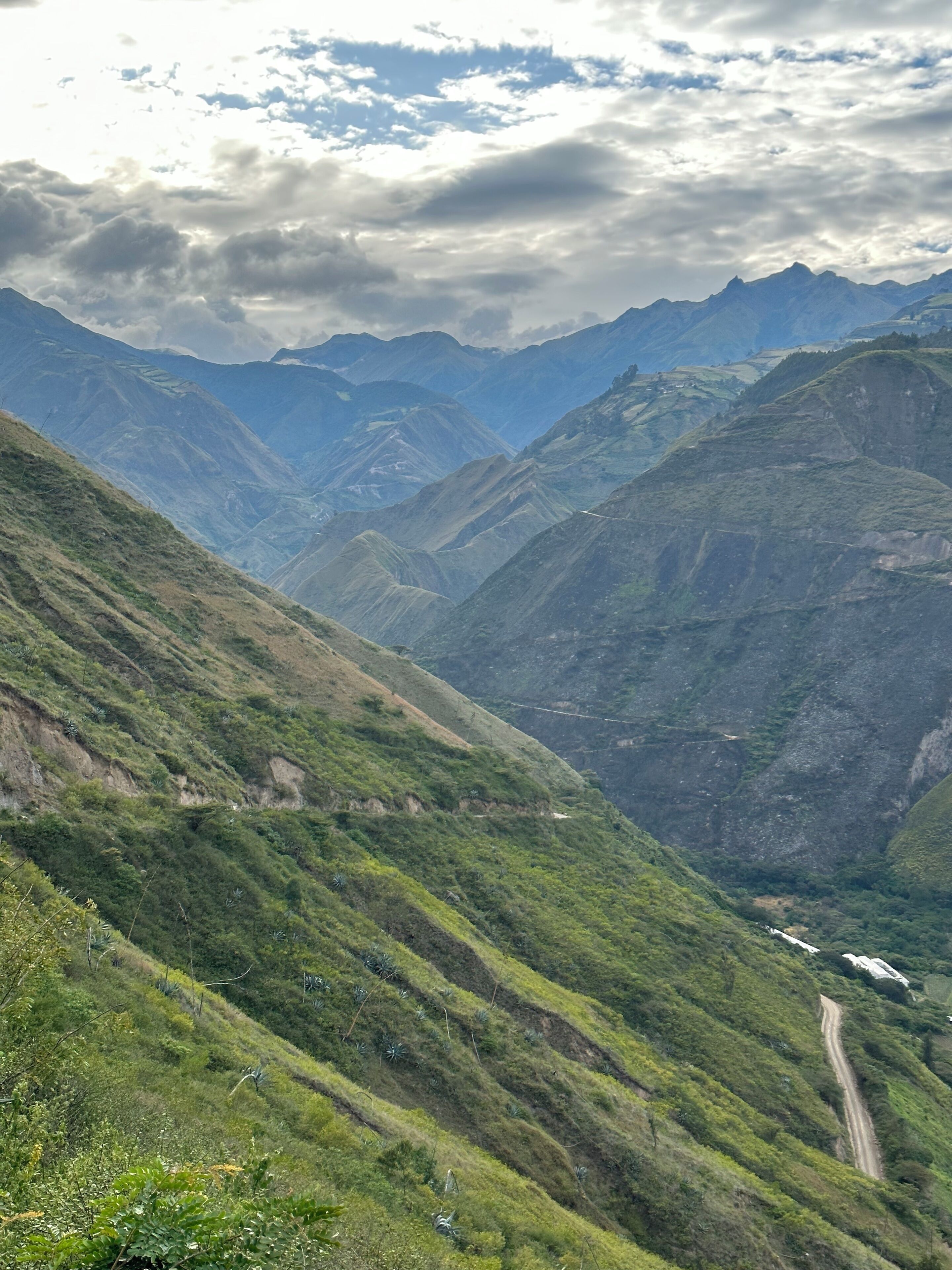 A mountainous landscape with a winding road.