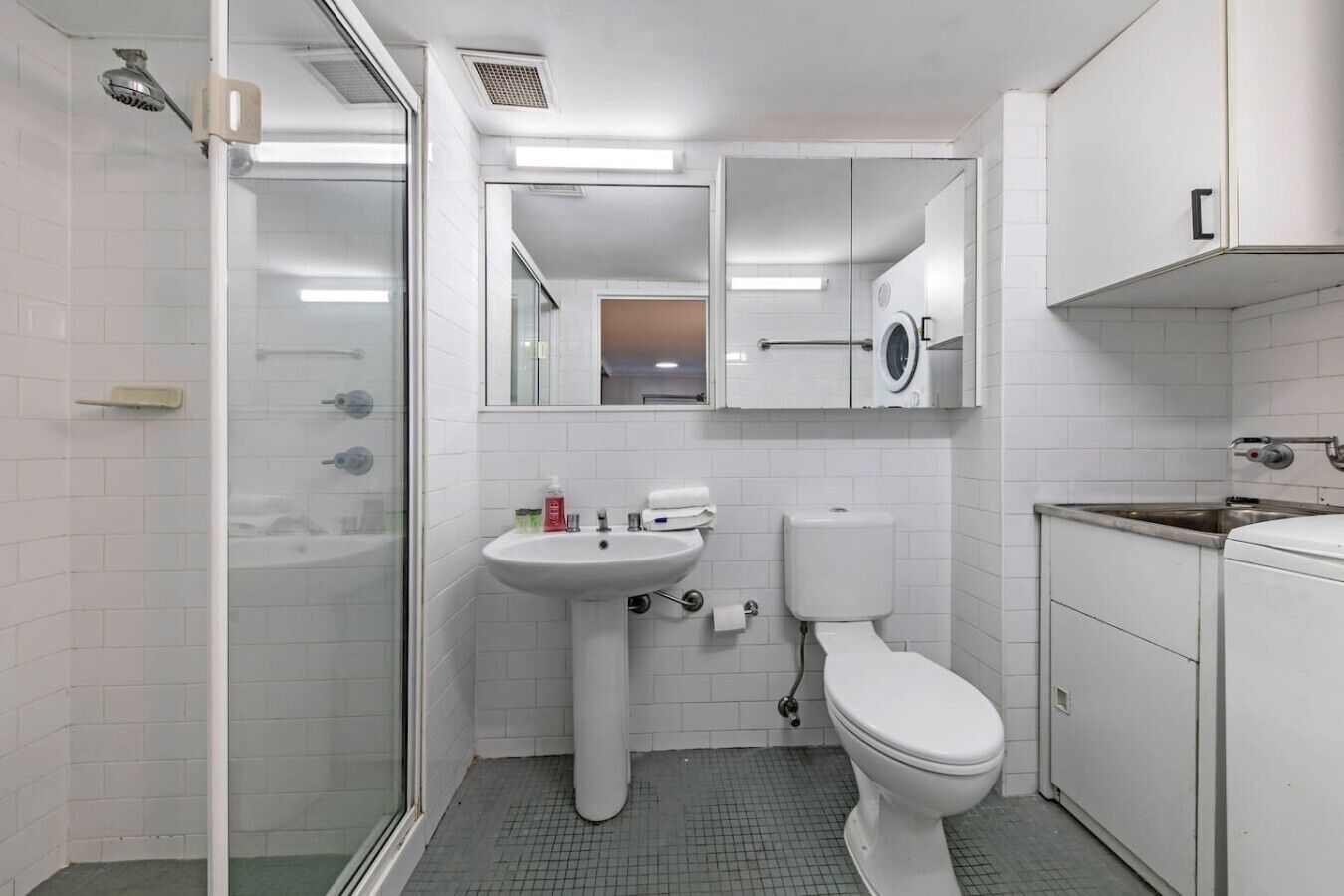 Shower, towels, soap, toilet paper