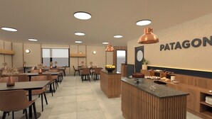 A modern restaurant interior with a central wooden bar, multiple dining tables, and pendant lighting. - Patagon Hotel (El Calafate)