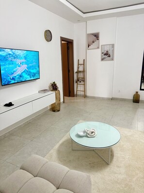 Living area - Paros Cosy House - Écrin Stay - Pool and Gym - Bright T2 (Dakar)
