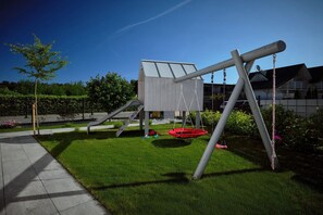 A playground with swings and a climbing structure. - Luxury holiday homes near the beach, Mielno (Mielno)