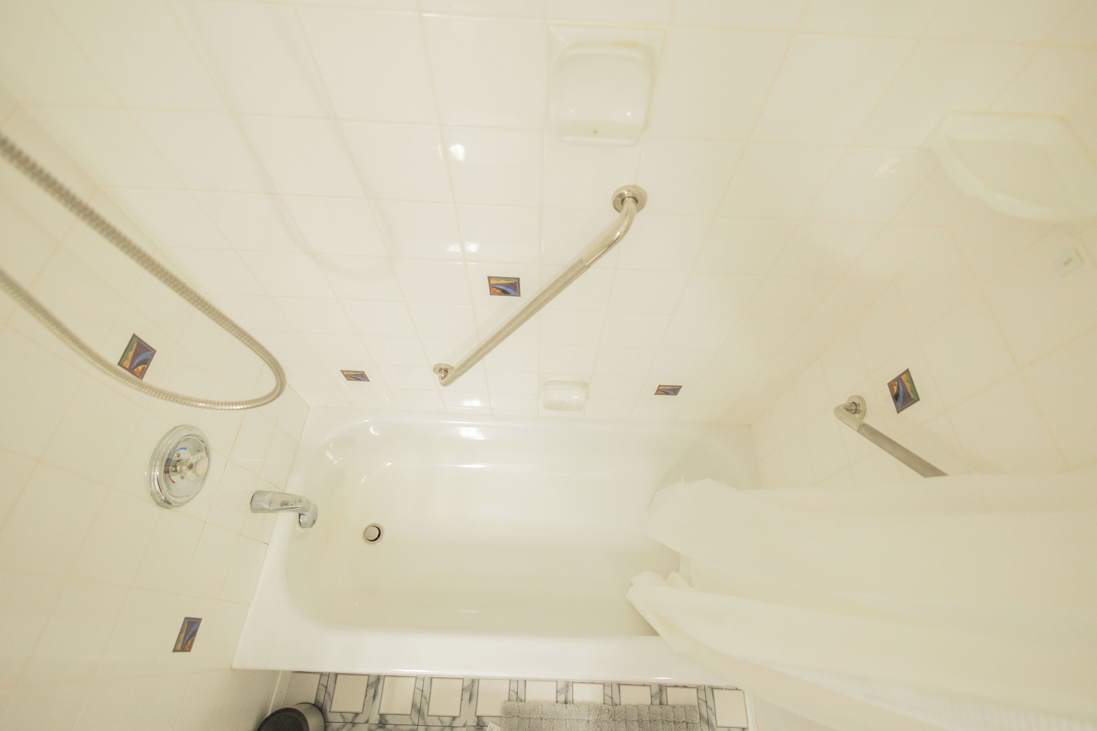 A bathroom with a bathtub, a shower, and a toilet.