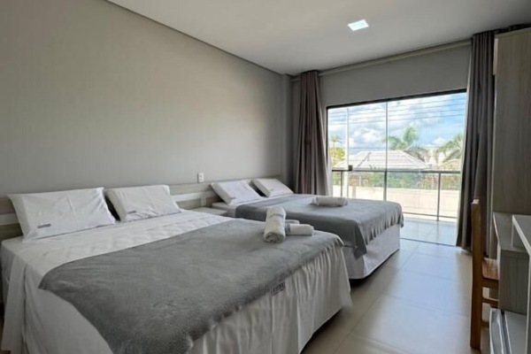 Quadruple Room, City View | Desk, laptop workspace, WiFi (free), bed sheets