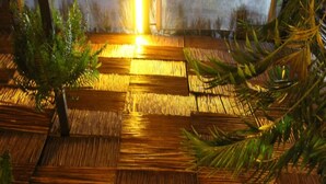 A bamboo floor with a warm light source above.