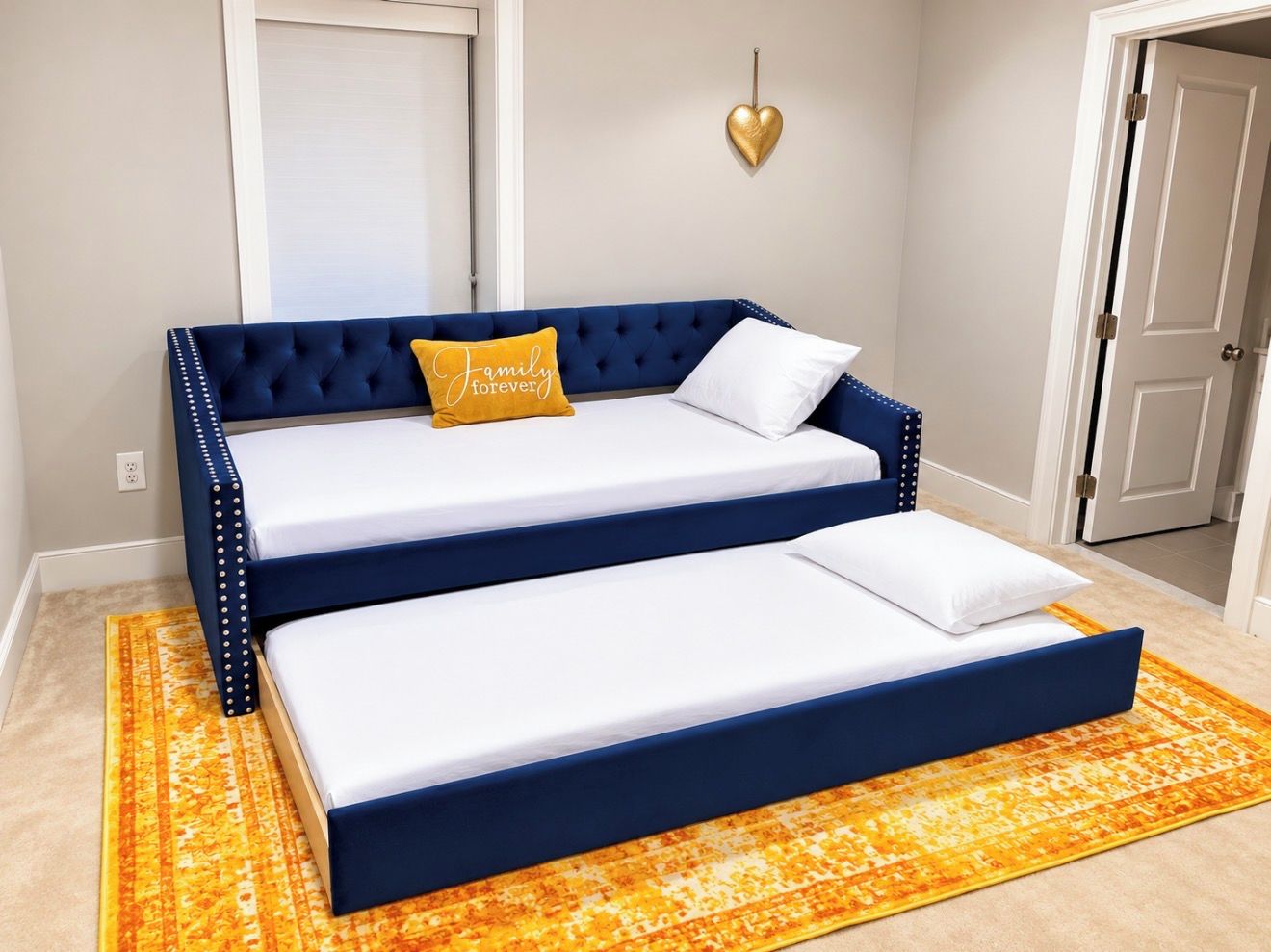 A two-tiered sofa bed with white bedding and a single yellow pillow with text.