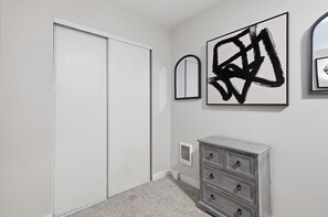 A room with a closet, a dresser, and two wall-mounted mirrors. - Fabulous 2-bedroom apartment in welcoming Eugene for your stay (Eugene)