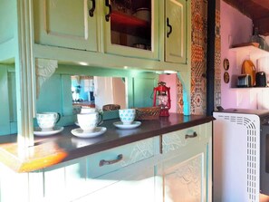 A kitchen with a wooden countertop, a red lantern, and patterned wall tiles. - Mateo's Mountain View House: For Animal Lovers (Trevijano)