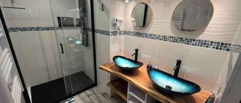 Shower, hair dryer, towels, soap