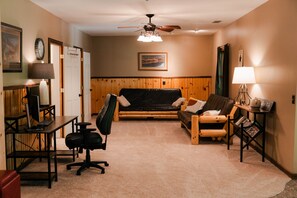 A room with a desk, computer, office chair, sofa, and a ceiling fan. - Big Rock | Theater Room, Hot Tub, Hocking Hills (Rockbridge)