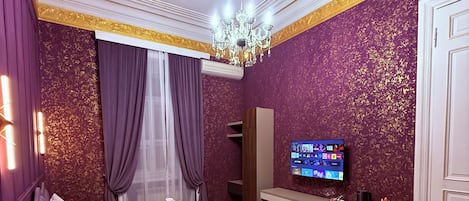 Family Suite, City View | Desk, laptop workspace, iron/ironing board, free WiFi