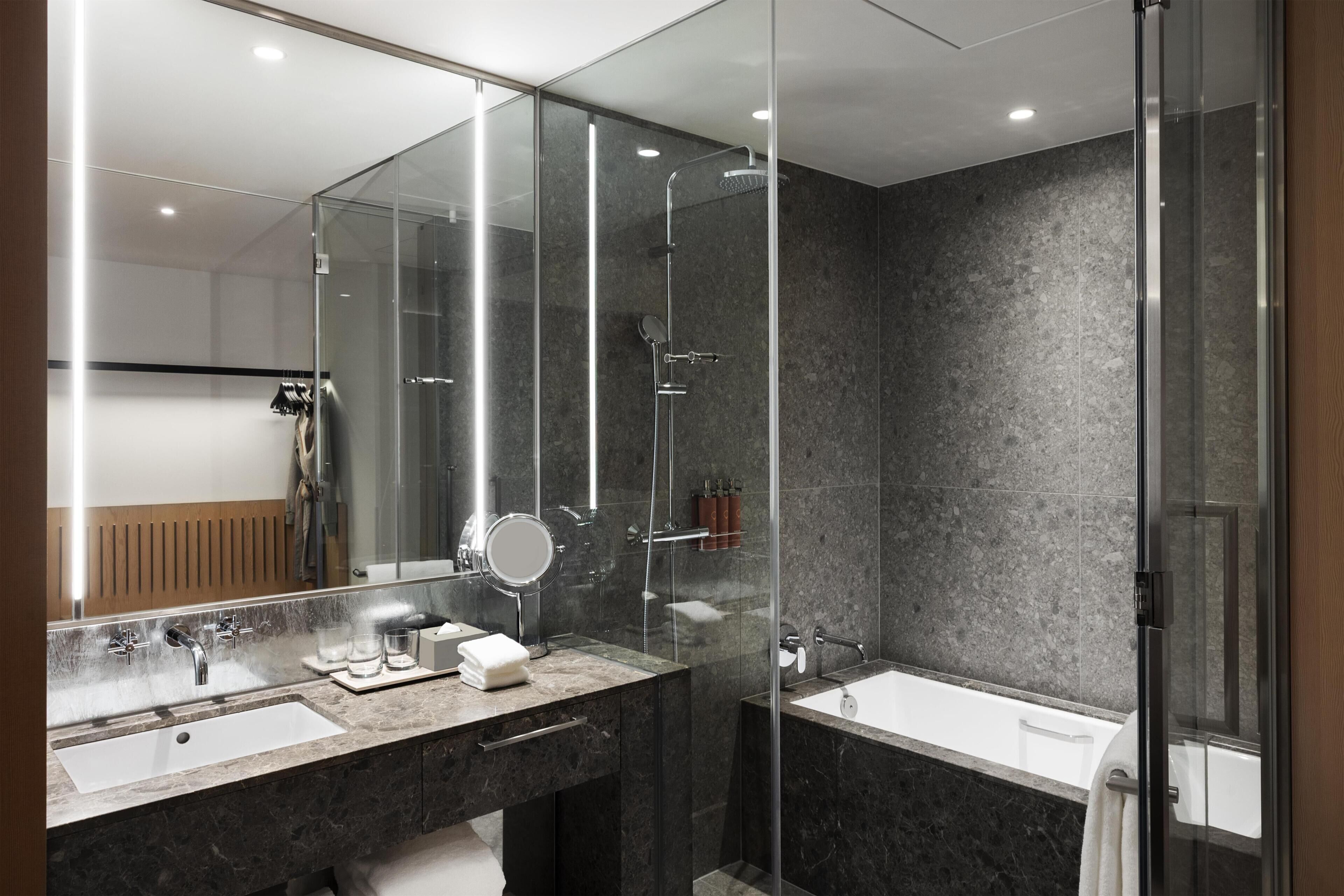 Separate tub and shower, rainfall showerhead, hair dryer, bathrobes