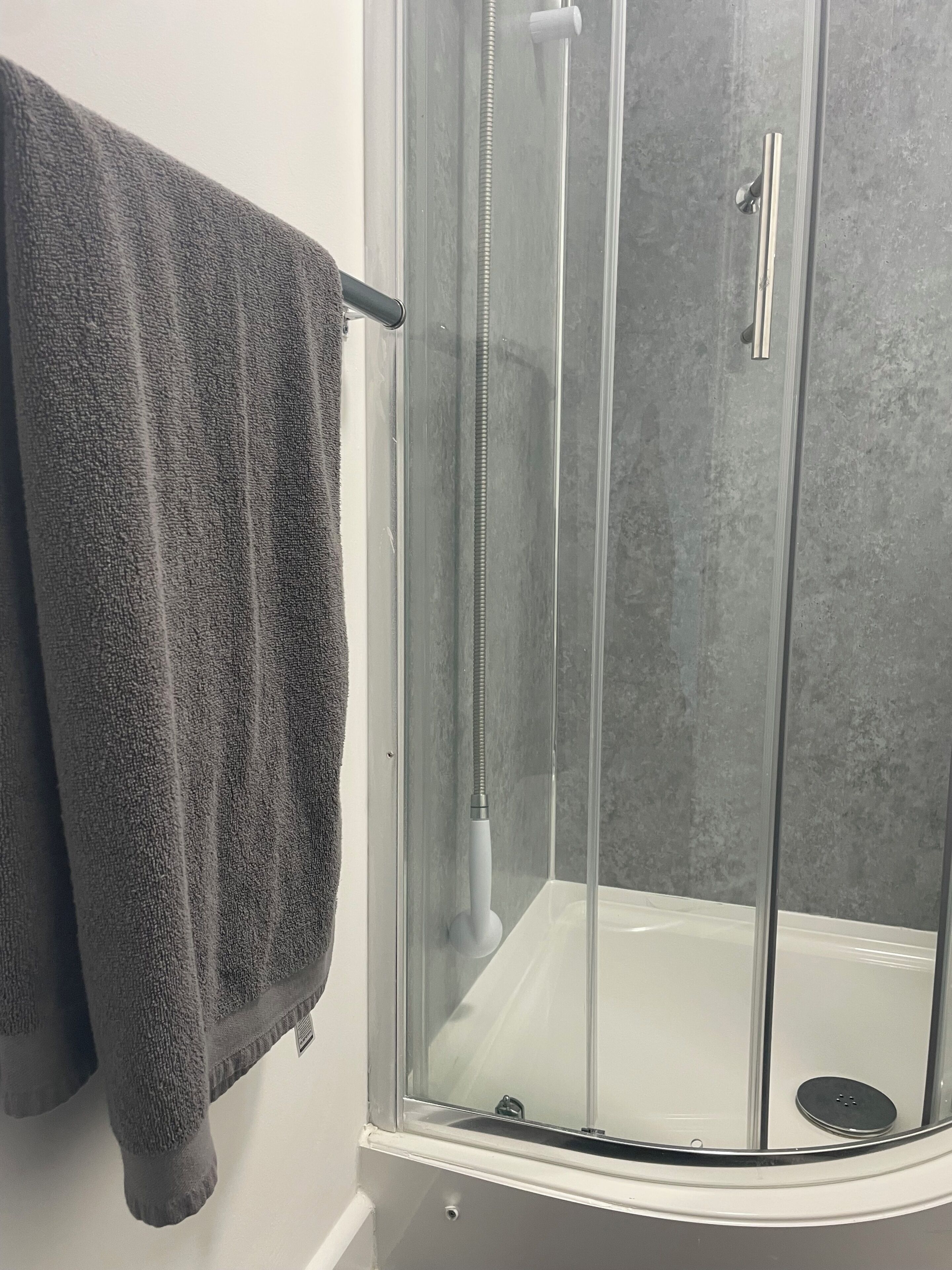 Shower, towels, soap, toilet paper