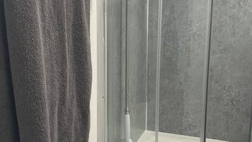 Shower, towels, soap, toilet paper