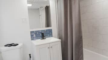 Shower, hair dryer, towels, shampoo