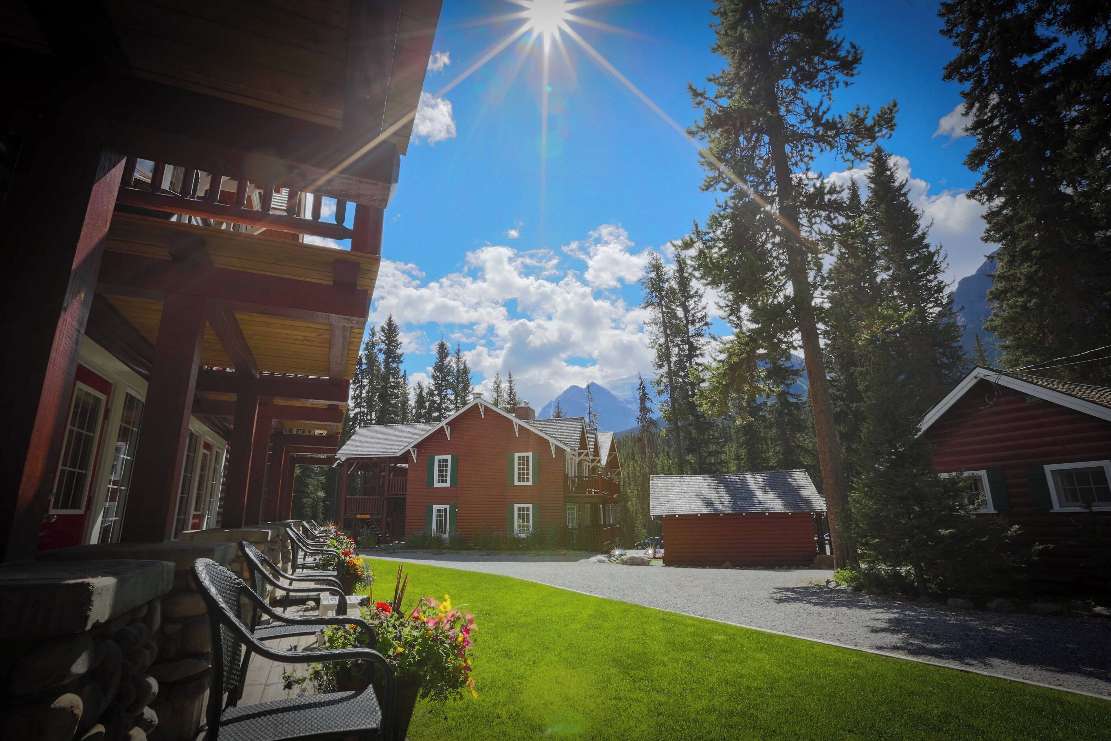 Towering pines, blue skies, and the warmth of a classic mountain lodge make for an unforgettable escape.