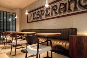 A restaurant interior with booths, tables, and chairs. - Esperanca Hotel Braga Vignette Collection By Ihg (Braga)