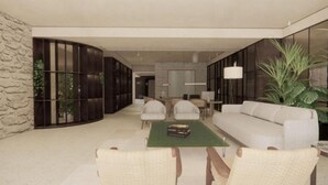 A modern living room with a sofa, chairs, a coffee table, and a bookshelf. - Esperanca Hotel Braga Vignette Collection By Ihg (Braga)