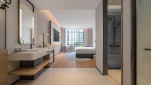 A modern hotel room with a large window, a shower, a bed, and a desk. - Holiday Inn Express Beijing Guomao CBD By IHG (Beijing)