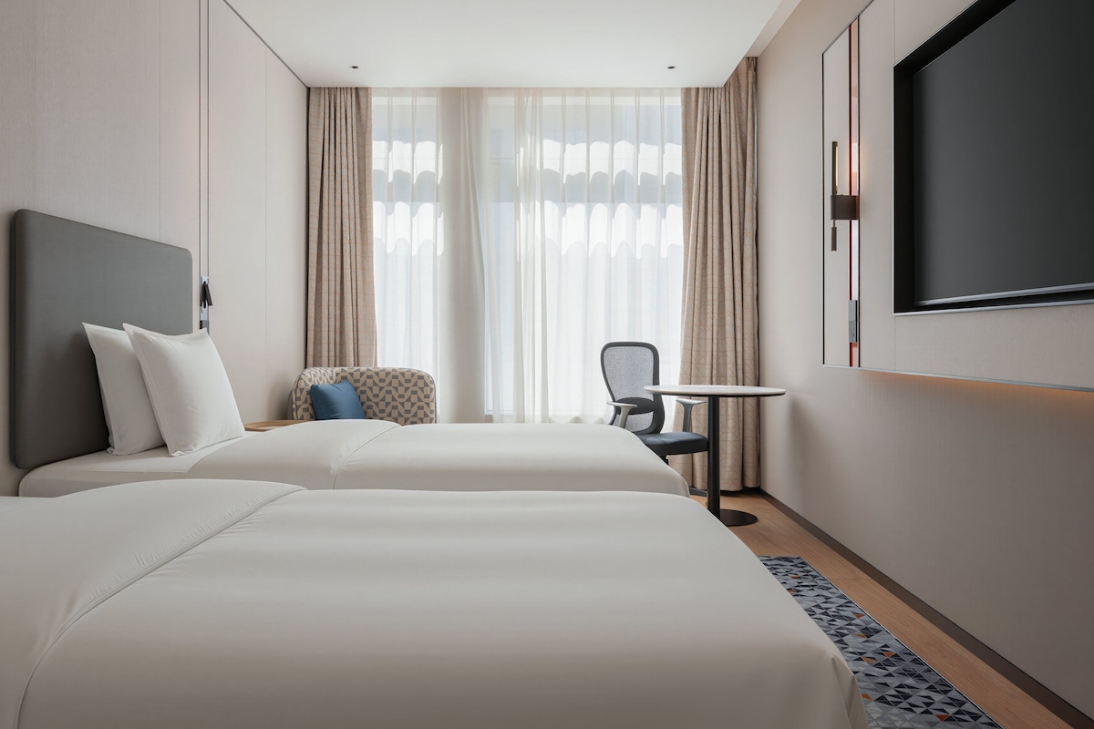 2 Single Standard City View | Down comforters, desk, blackout drapes, soundproofing