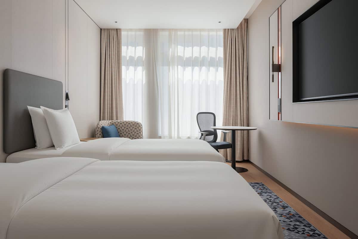 2 Single Standard City View | Down comforters, desk, blackout drapes, soundproofing