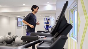 A gym with treadmills, exercise balls, and a motivational sign. - Holiday Inn Express Sapporo Susukino by IHG (Sapporo)