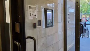 A modern elevator with a control panel, a security intercom, and a sign with instructions. - City Center, Murphy Bed & Kitchen 300 Airport bus. private condo with balcony (Calgary)