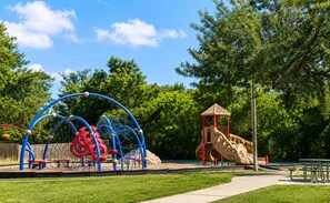A playground with a slide, climbing structures, and a small pavilion. - Military-Friendly 3BR 2 BA Schertz Retreat Near Randolph AFB Sleeps 8 (Schertz)
