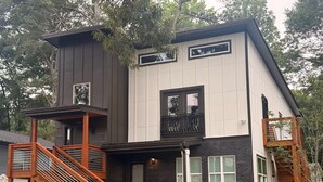 A modern two-story house with a balcony, a staircase, and a small front yard. - Sweet Atlanta Escape (Atlanta)