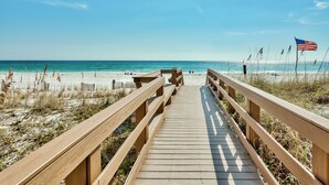 A wooden boardwalk leading to a beach with a clear sky. - 🌴Island Princess 203 | Gulf Views | Pool + Hot Tub🌴 (Fort Walton Beach)