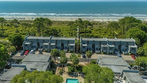 A beachfront motel with multiple-story buildings, a swimming pool, and a beach view. - Oceanfront Complex - New Rental
- Steps to Beach/Pool/Coligny 
- Sleeps 6pp (Hilton Head Island)
