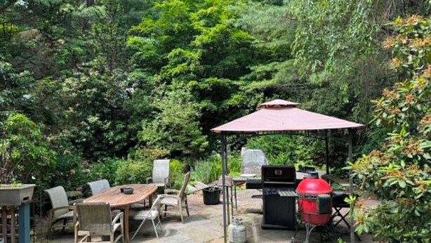 An outdoor patio with a table, chairs, a grill, and a gazebo. - Private Garden Estate, Jacuzzi, Cinema & Games (Southborough)